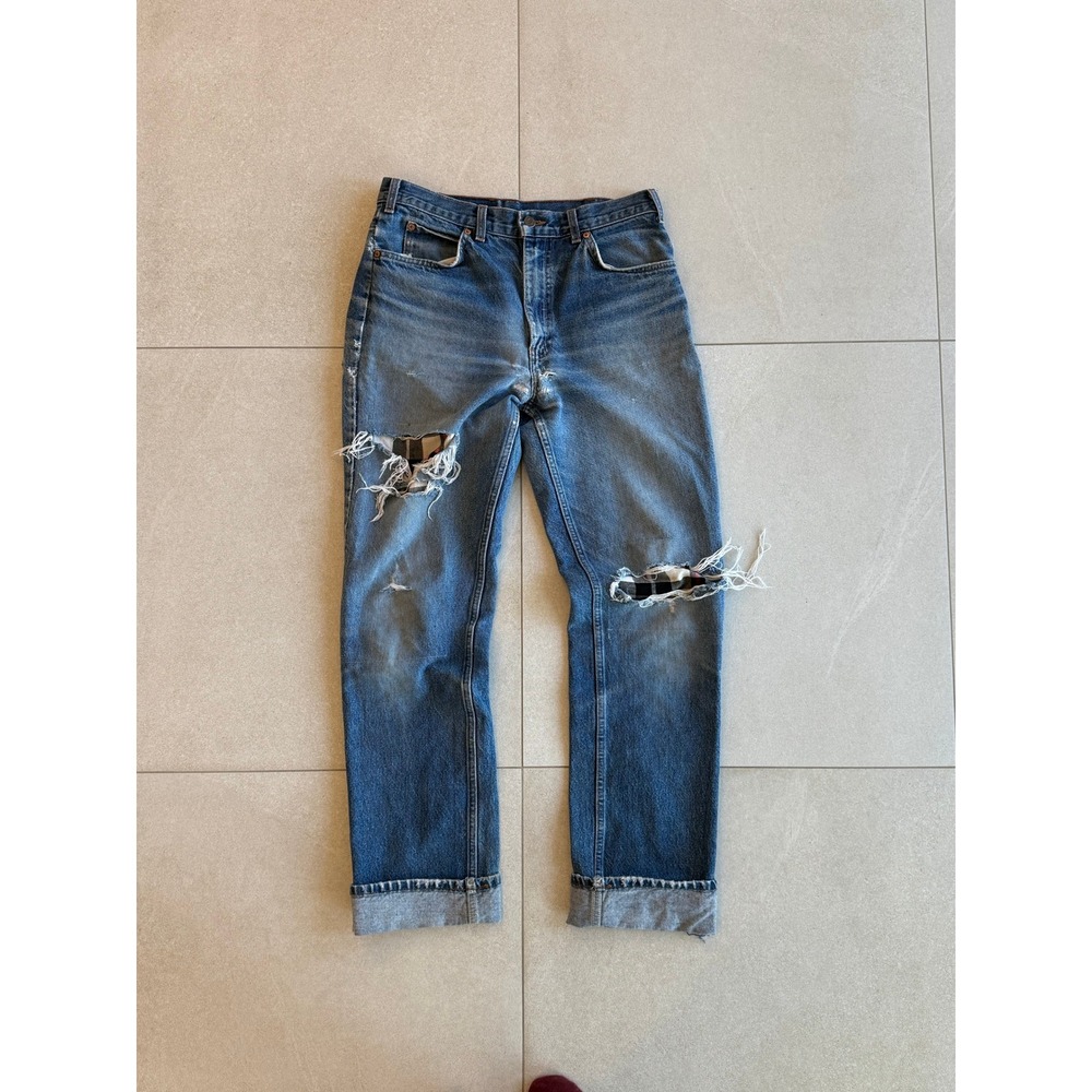 Vintage Levis 619 Orange Tab thrashed and repaired jeans